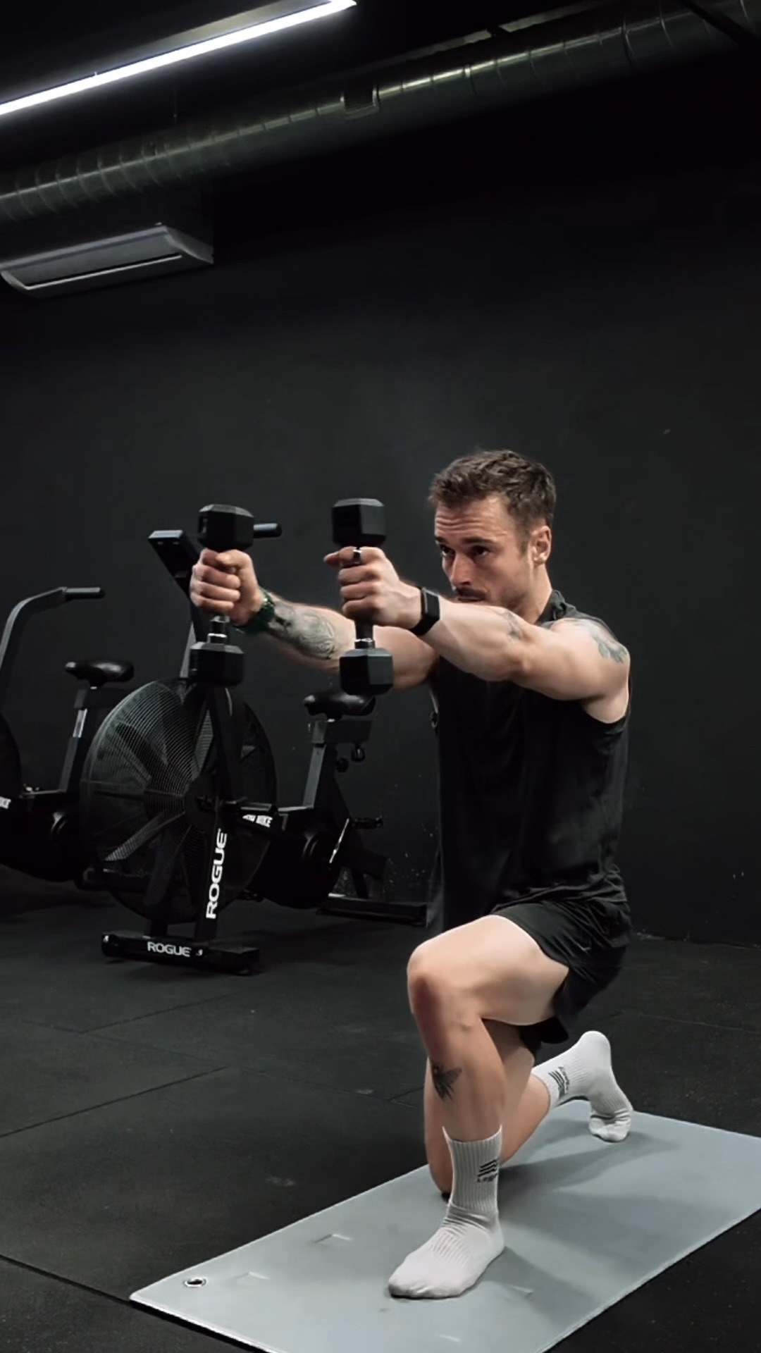 Tiago strength training with dumbbells
